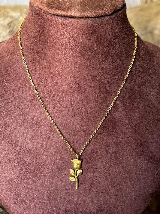Gold necklace with a rose pendant