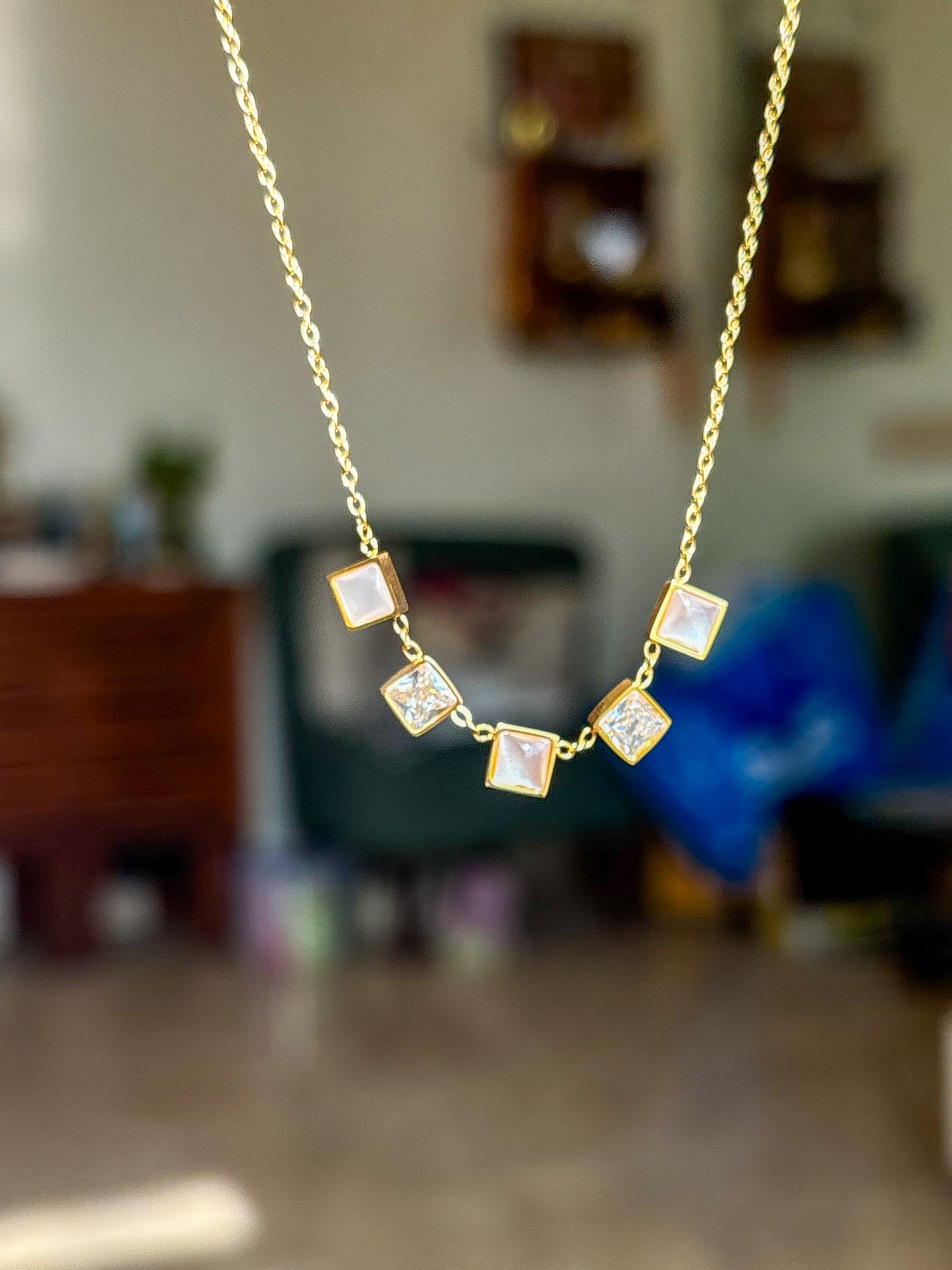 Minimalist gold charm necklace with iridescent square stones for daily wear