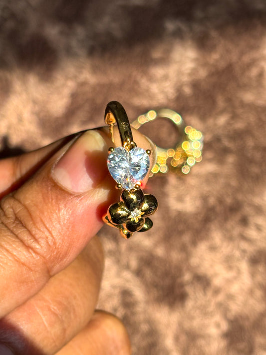 Stylish women’s gold earrings featuring heart-shaped crystal pendant