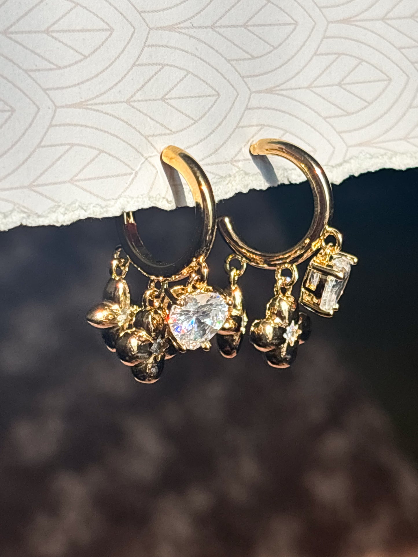 Minimalist gold earrings with heart crystal and floral drop charm