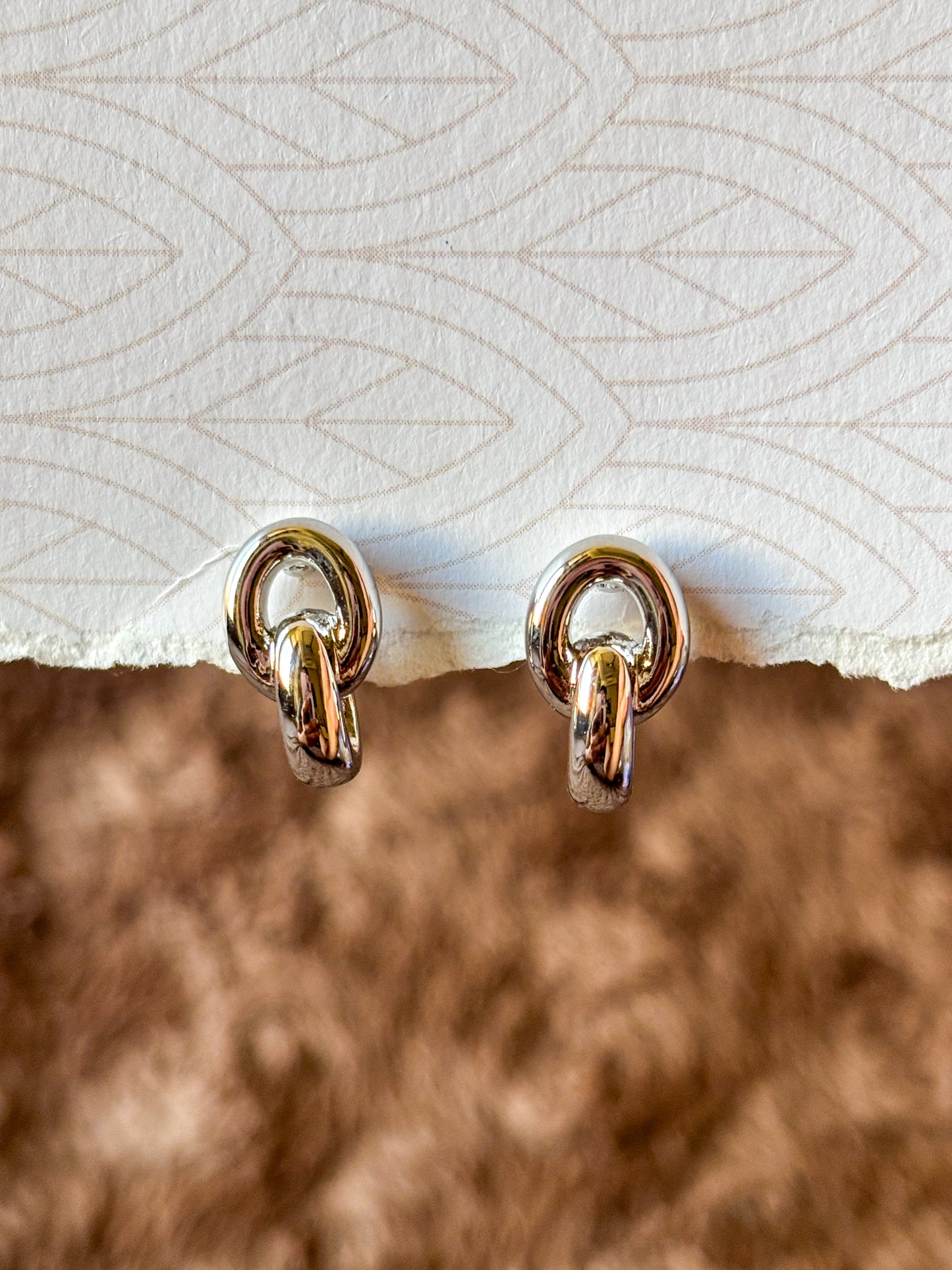 silver knot studs perfect for everyday wear.